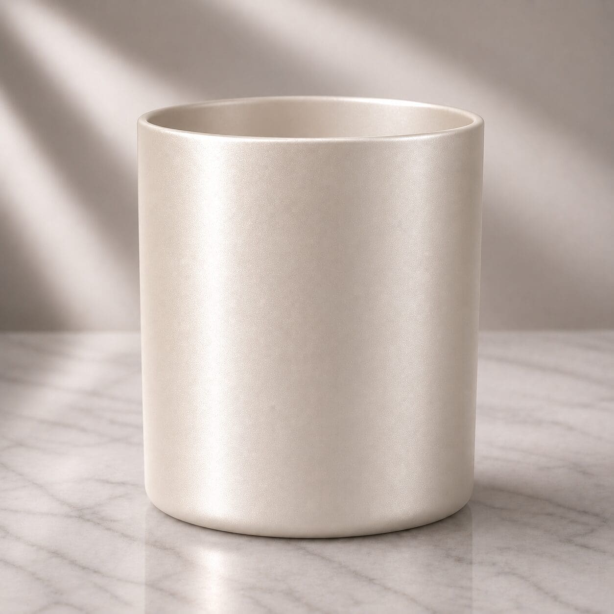 Plain white ceramic mug on marble surface with soft natural lighting and neutral background